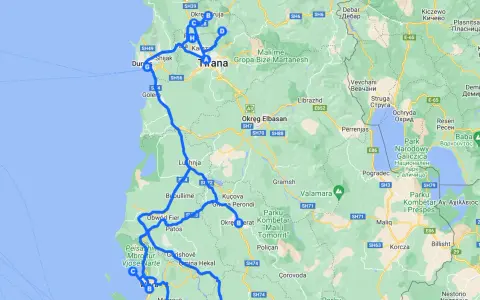Trasa drogowa przez Albanię, pokazująca główne **lotniska w Albanii** i miasta takie jak Tirana, Durrës, Fier i Korcza.